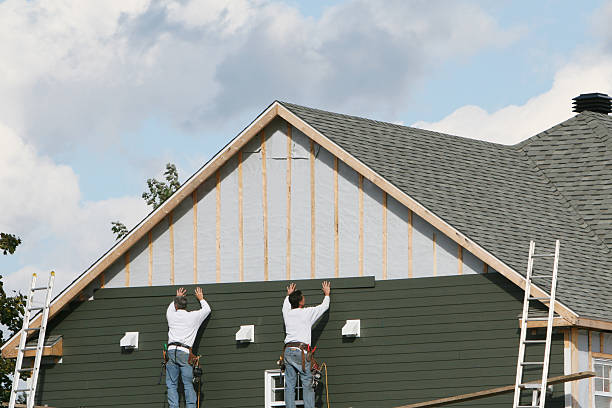 Professional Storm Damage Siding Repair technician working in Everett, MA